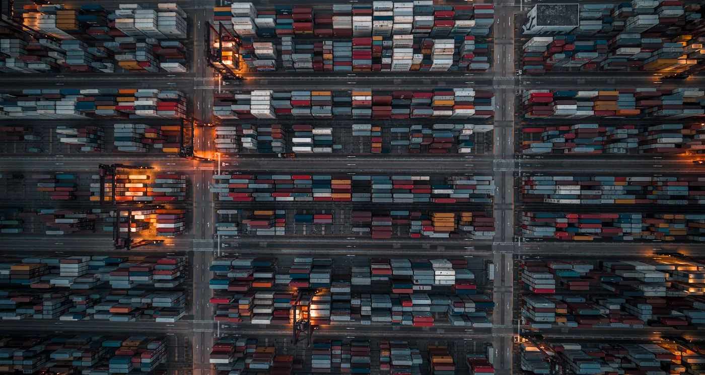 Aerial view of a freight yard laid out in loading lanes and container rows