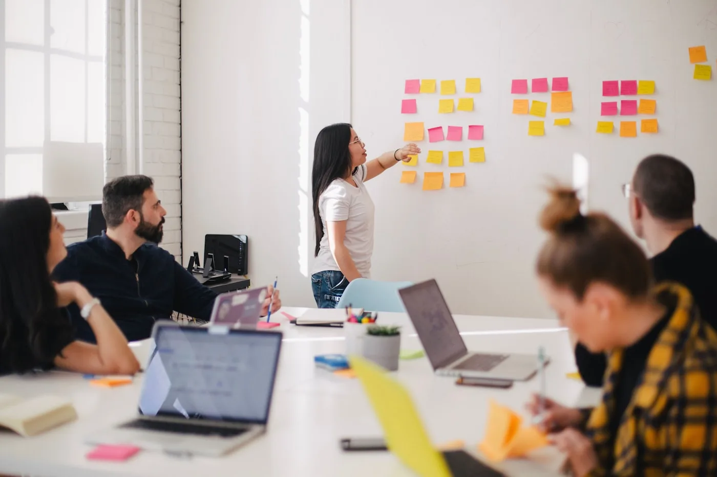 Team planning session around a meeting table in an office