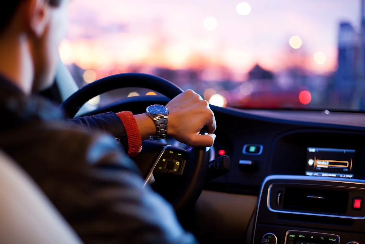 Driver at the wheel on a consignment run at dusk